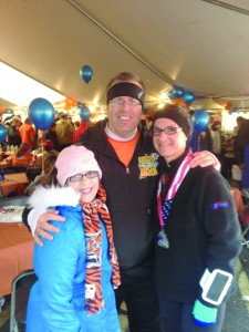 After running her first half-marathon, Sharon Harding poses with two of her supporters: Buddy Shuh and her daughter Kass. 